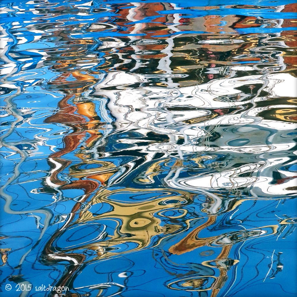 blue chaos in Newlyn harbour reflections